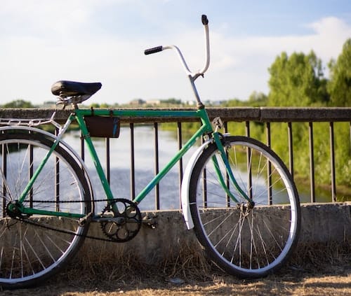 Bicycle parked on bridge