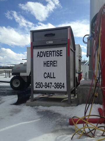 A large garbage container with a phone number on the front